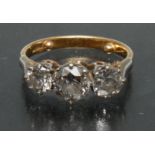 A diamond trilogy ring, central round old brilliant cut diamond approx 1.