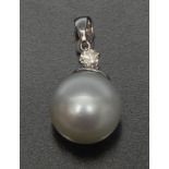 A south sea cultured pearl and diamond pendant, single creamy white pearl, approx 13.