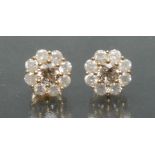 A pair of diamond cluster earrings, central fancy light brown round brilliant cut diamond approx 0.