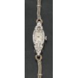 Rolex - a lady's diamond encrusted cocktail watch, rectangular dial,
