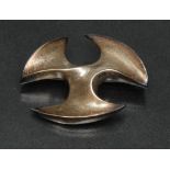 Ernest A Blyth for Ivan Tarrant, a modernist silver oval brooch, shaped triple indented body,