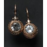 A pair of diamond and pale blue stone earrings,