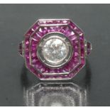 An Art Deco style ruby and diamond ring, central round brilliant cut diamond, approx 1.