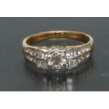 A contemporary design diamond ring, central round brilliant cut diamond approx 0.