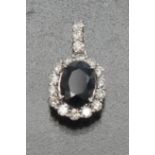 A deep blue sapphire and diamond pendant, central Kashmir type deep blue oval sapphire, approx 1.