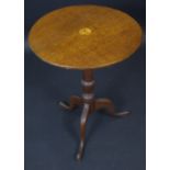 A George III oak occasional table, the circular top inlaid wih paterea, cannon barrel column,