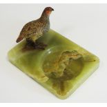 An Austrian cold painted bronze, of a partridge, mounted on an onyx dish, 17cm wide, c.