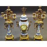 A 20th century 'Delft' and gilt metal mounted clock garniture,
