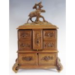 A 19th century Black Forest jewellery box, with deer and tree cresting, hinged cover,