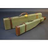 A 20th century green canvas rectangular gun case, leather straps and handle,