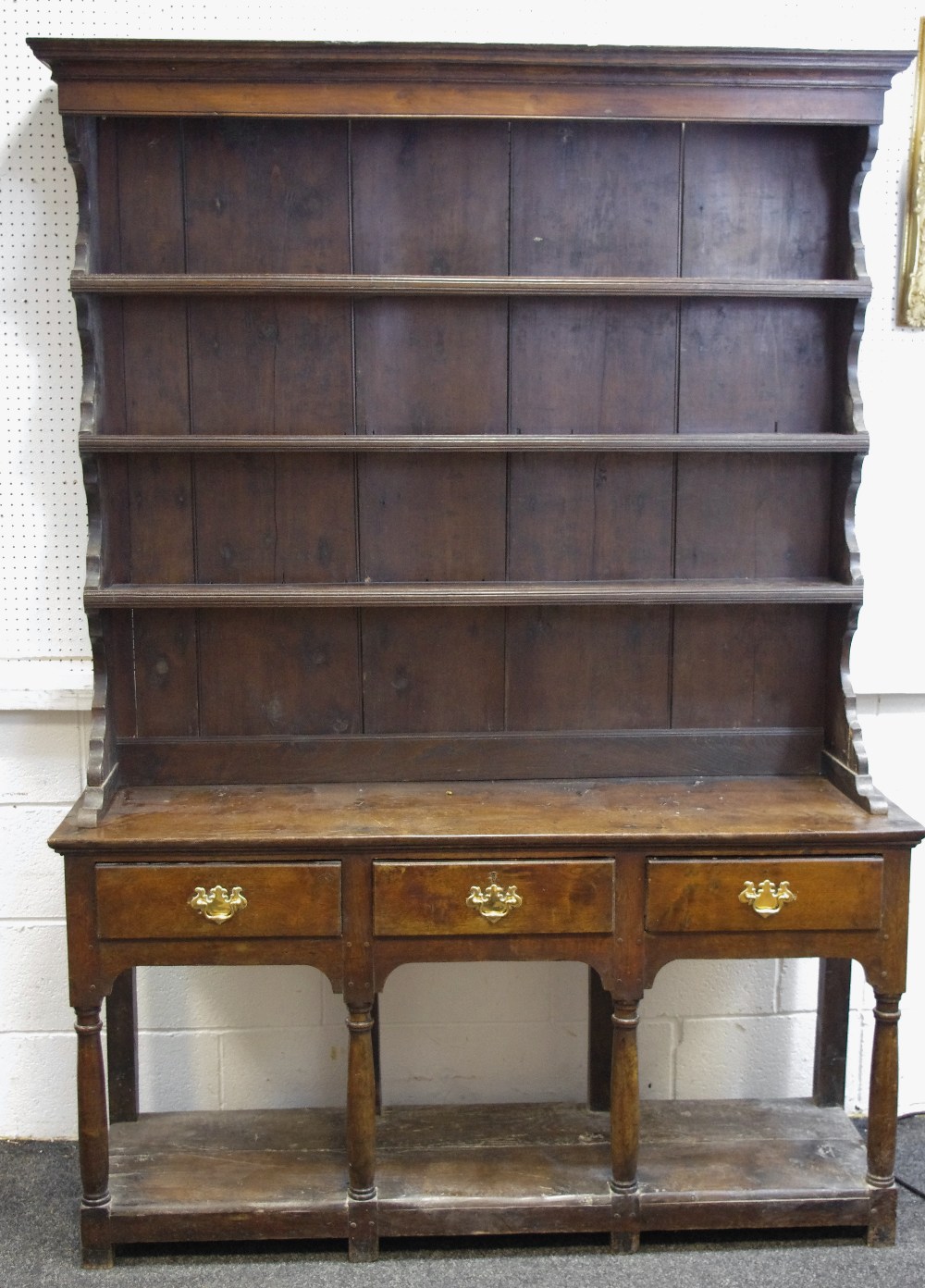 An 18th century oak and elm high back dresser,