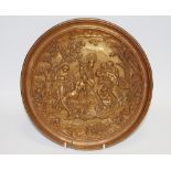 A 19th century neo-classical bronze wall plaque, embossed with classical figures, 26cm diam, c.