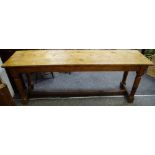 A late 18th century pine tavern table, planked top, turned legs, refectory stretchers, 76cm high,