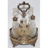 A 19th century silver plated six bottle cruet stand, clear glass boles and jars, posed loop handle,