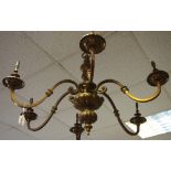 A pair of large 19th century six branch brass chandeliers, scrolling arms, outswept bulb holders,