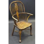 A 19th century elm and beech Windsor wheel back chair, crinoline stretcher, club feet, c.