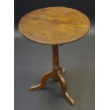 A George III oak occasional table, turned column, tripod legs, pad feet, 65cm high, 51cm diam, c.