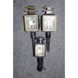 A pair of late 19th century black carriage lamps,