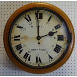 An early 20th century oak wall clock, the 30cm dial with Roman numerals, inscribed Burrell,