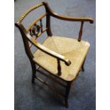 A late 19th century "Trafalgar" chair, ship stern shaped back, c.1900.