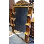 An Edwardian walnut over mantel mirror, arched cresting, carved with oak leaves,