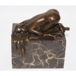 French Scool, a bronzed figure of a prostrate nude lady, on a marble plinth,