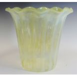 A Victorian vaseline glass light shade, wavy rim, 23cm high, c.