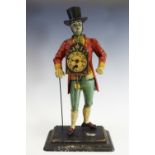 A reproduction figural clock, of a gentleman, wearing a top hat, red jacket,