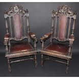 A pair of Jacobean style open armchairs,lions and shield top rail, padded back and arms,