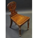 A Victorian mahogany hall chair, shield shaped back, turned legs, c.