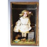 A 19th century German bisque head doll, blue eyes,