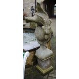 Garden statuary - a reconstituted stone garden post, with wrythen gargoyle wrapped around a ball,