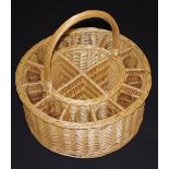 A contemporary wicker champagne basket, of cylindrical form,