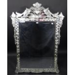 A substantial Venetian style rectangular wall mirror, he cresting with leaves and foliage,