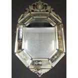 An early 20th century Venetian hexagonal cushion mirror, lofty cresting,