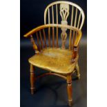 A pair of yew and elm Windsor chairs, spindle back, pierced and shaped splat, saddle seat,
