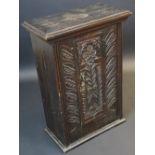 An 18th century rectangular hall cupboard, the door later carved with leaves, 85cm high,