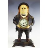 A reproduction American type cast iron novelty mantel clock,