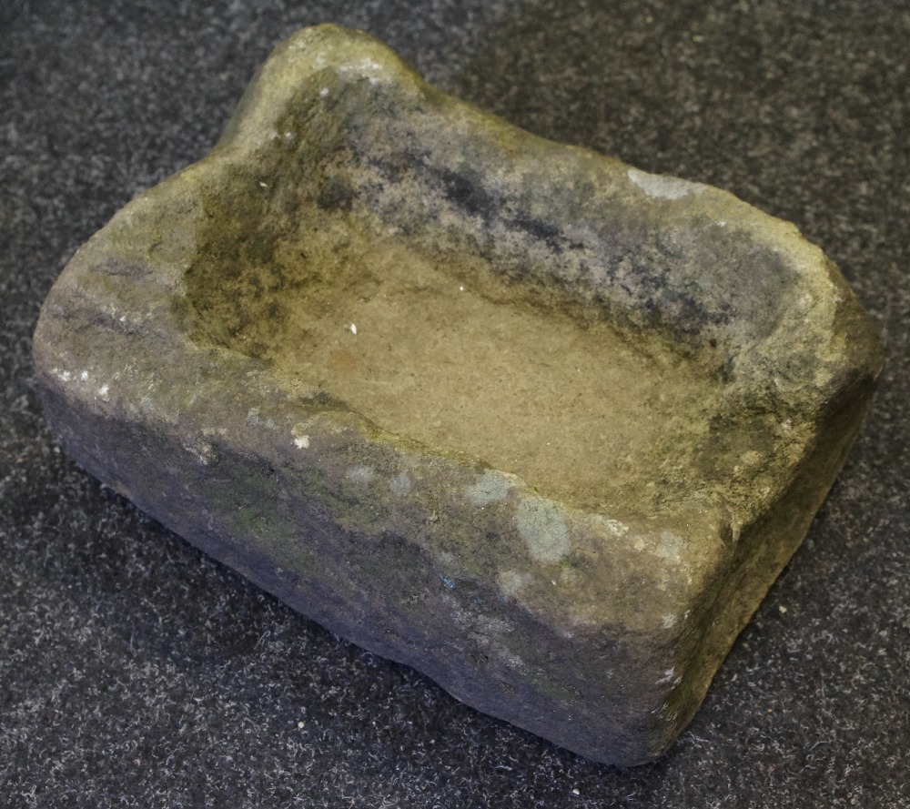 A Medieval limestone holy water stoup,
