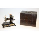 An early 20th century German FWM hand crank sewing machine, of small proportions,