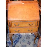 A Queen Anne style bureau, fall front enclosing a writing surface,