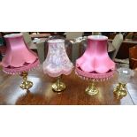 A pair of brass table lamps;