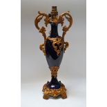 A 19th century French gilt metal mounted table lamp, heavy blue glaze, 46.