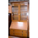 An early-mid 20th century bureau bookcase,