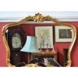 A contemporary 'gilt' framed wall mirror, crested by a shell flanked by scrolling acanthus,