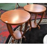 A pair of contemporary occasional tables, circular top, the undertier conforming,