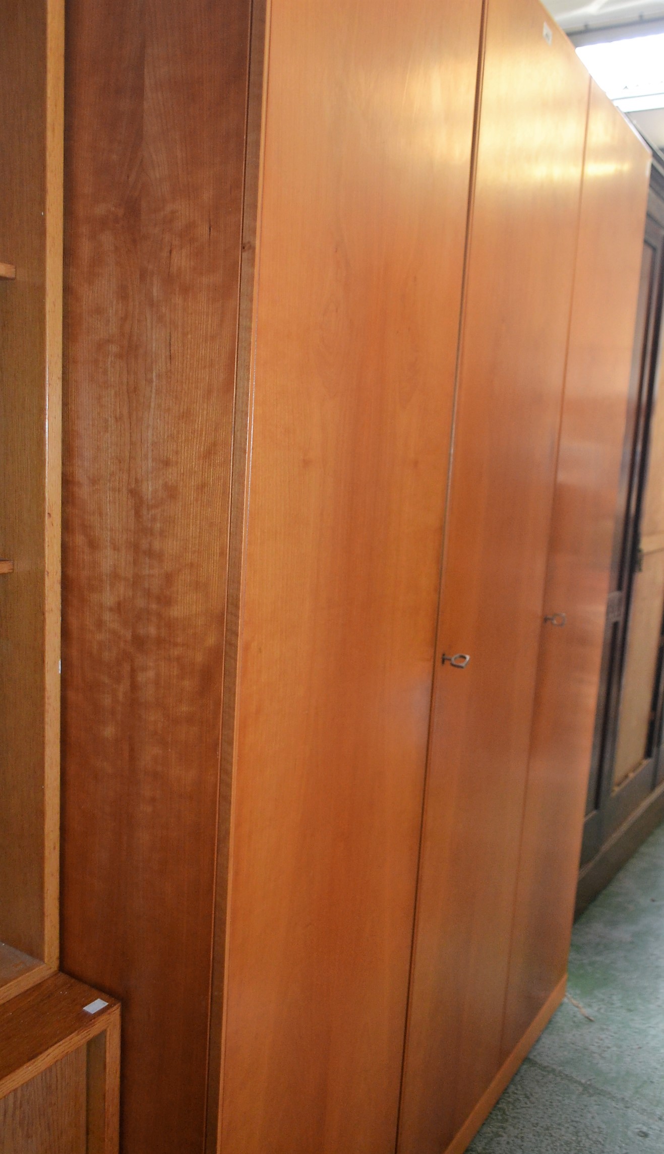 A mid-20th century design triple wardrobe, 200.