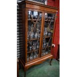 A 20th century mahogany display cabinet,