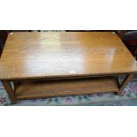 A contemporary oak coffee table, rectangular top above a conforming undertier,