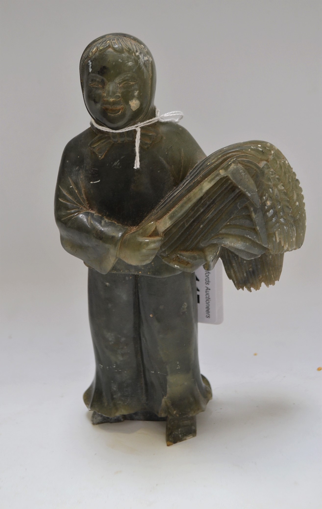 A Chinese Republican soapstone figural carving, as a female peasant,